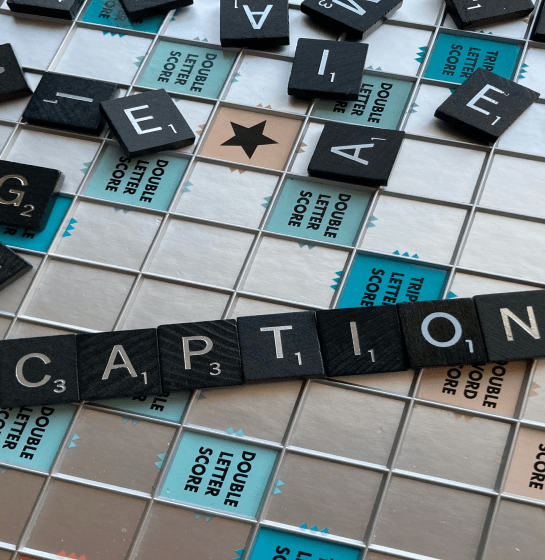 Scrabble letters saying caption